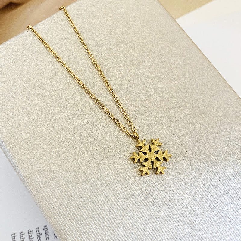 Wholesale Titanium Steel Color Gold Frosted Small Snowflake Necklace